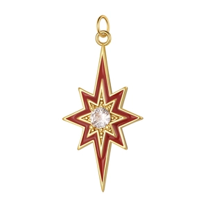 Detailed macro of golden octagonal star pendant with red enamel and clear zircon stone