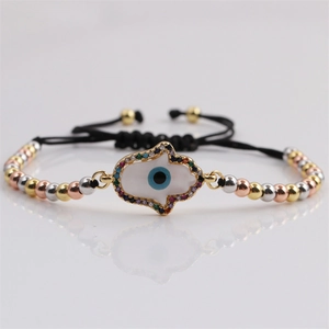 Bracciale etnico intrecciato con Mano di Fatima e Malocchio in oro, argento e oro rosa