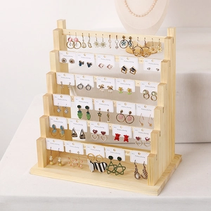 Multi-tier solid wood earring display stand with natural finish for jewelry organization