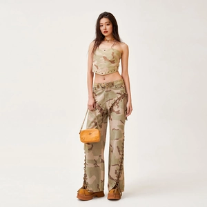 Women's camouflage tube top and matching fringe wide-leg jeans set with yellow chain bag