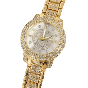 Macro shot of luxury gold-tone watch bezel and strap encrusted with brilliant crystals