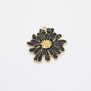 Detail showing a black enamel daisy flower pendant with gold plating for jewelry making