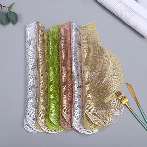 Hollow turtle leaf PVC placemats in gold, silver, and green for dining table decor