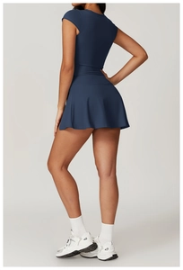 Detail view of the deep blue high-elastic sports dress back design and pleated hemline