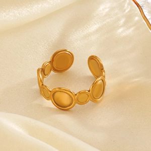 Minimalist geometric circular gold plated stainless steel ring on silk background
