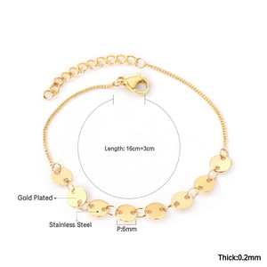 Detail view of gold plated stainless steel bracelet with 6mm circular pendants and lobster clasp