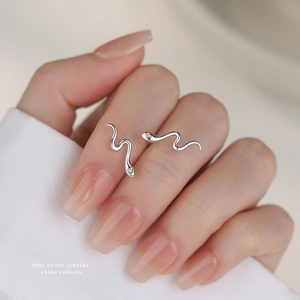 Minimalist S925 sterling silver snake earrings with clear zircon on model hand