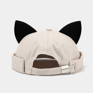 Close-up of beige miki hat featuring cute cat ears and adjustable silver metal buckle