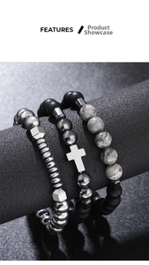Detailed view of 3-piece beaded bracelet set with silver cross charm and marble stones