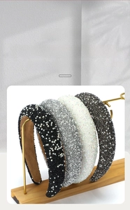 Detail of wide padded headbands with sparkling rhinestones and elegant pearls in four colors