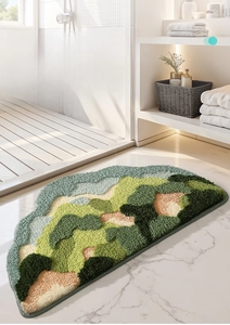 Close-up of semi-circle bathroom mat with mountain landscape flocking texture