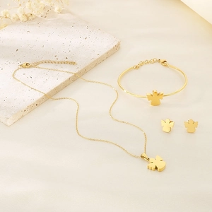 Detailed view of the gold jewelry set including an angel necklace, bracelet, and earrings