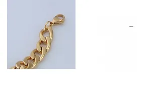 Close-up of golden thick curb chain link with lobster clasp for women fashion jewelry