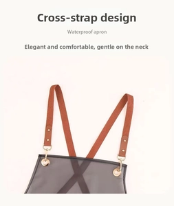 Detail of waterproof apron with cross back straps and golden metal buckles