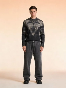 Men's relaxed fit washed denim jeans paired with a geometric print sweatshirt set