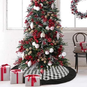 Classic 120cm black and white plaid Christmas tree skirt in a cozy holiday home setting