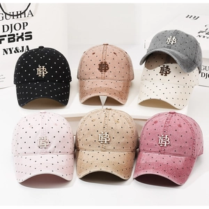Collection of vintage washed cotton baseball caps with polka dots and metal logos