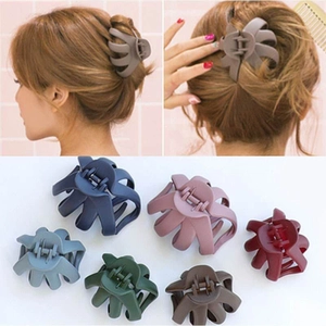 Matte octopus hair claws in six colors shown on model and flat lay for thick hair