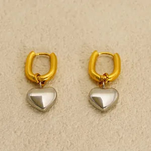 Boucles d'oreilles cœur bicolores avec créoles dorées et pendentifs cœurs argentés