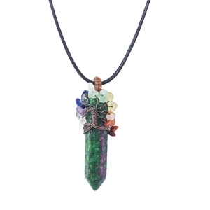 Macro detail of Tree of Life crystal necklace with wire-wrapped green gemstone column