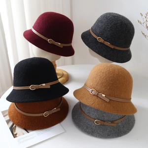 Detail view of wool cloche hats in various colors with elegant leather decorative belts