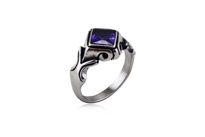 Detailed close-up of retro silver ring with square purple gemstone and Gothic engraving