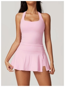 Detailed front view of pink yoga sports set featuring racerback top and pleated skort
