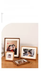 Close-up of rounded corners on black walnut photo frames with thick white mat inserts