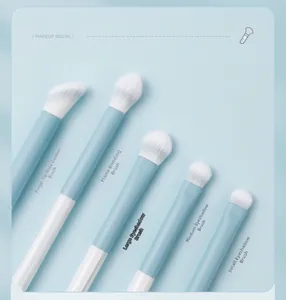 Detail of 5-piece makeup brush set featuring blue handles and soft gradient fiber bristles