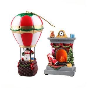 Christmas snowman in hot air balloon and Santa fireplace glowing resin ornaments