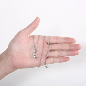 Minimalist silver irregular textured moon pendant necklace on a stainless steel chain