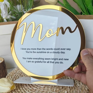 Detail of white acrylic Mom ornament with gold trim and poetic heartfelt message