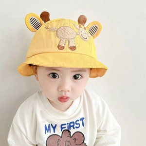 Detail of yellow cotton baby sun hat with cute 3D ears and cartoon horse embroidery