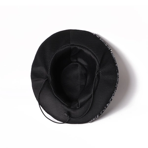 Detail view of the breathable mesh lining and adjustable drawstring on the black felt hat