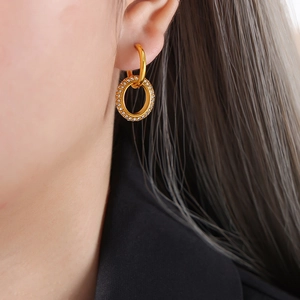 Double-layered 18k gold plated hoop earrings with shimmering crystals on model