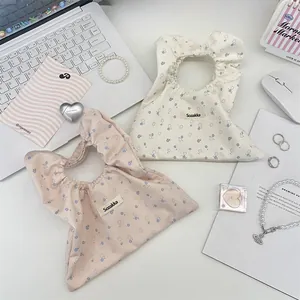 Set di pochette in cotone floreale con etichetta Sozakka, borse rosa e beige incluse