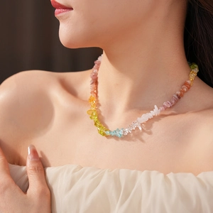 Close-up of woman wearing a vibrant colorful natural stone beaded necklace set for vacation