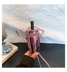 Pink milk tea cup shoulder bag with pearl details and a straw-shaped top accessory
