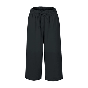 Detail of black linen wide-leg pants featuring an elastic drawstring waistband design