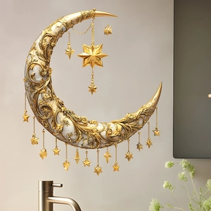 Detailed golden crescent moon wall decor with baroque carvings and hanging star pendants