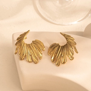Luxury gold flower earrings in vintage stainless steel on minimalist display base