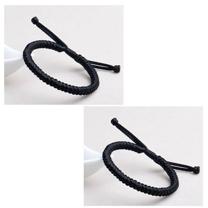 Detail of hand-woven black cord bracelet featuring a durable knot design and adjustable fit