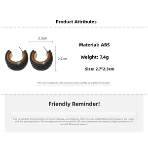 Detailed specs of retro C-shaped black textured earrings with gold inner plating