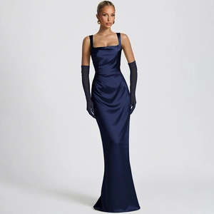 Close-up of elegant navy blue satin evening dress with matching sheer tulle gloves