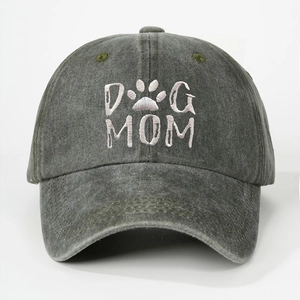 Detailed embroidery of DOG MOM text and paw print on dark gray washed cotton cap