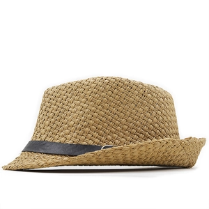 Close-up of cross-weave texture on a straw fedora with a black decorative band