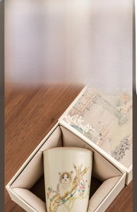 Detail of Ru Kiln celadon tea cup with cat motif in a luxury velvet lined gift box