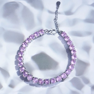 Elegant pink cubic zirconia tennis bracelet with silver claw setting and lobster clasp