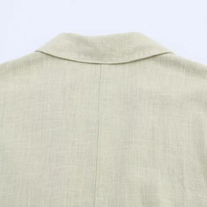 Close-up of the breathable linen fabric texture and stitching on the shirt collar