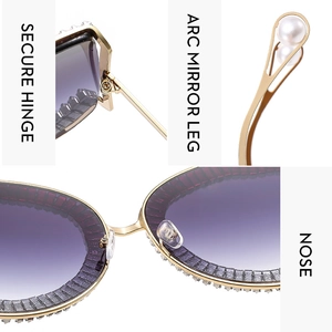Detail view of gold metal sunglasses showing crystal rhinestones and purple gradient lens